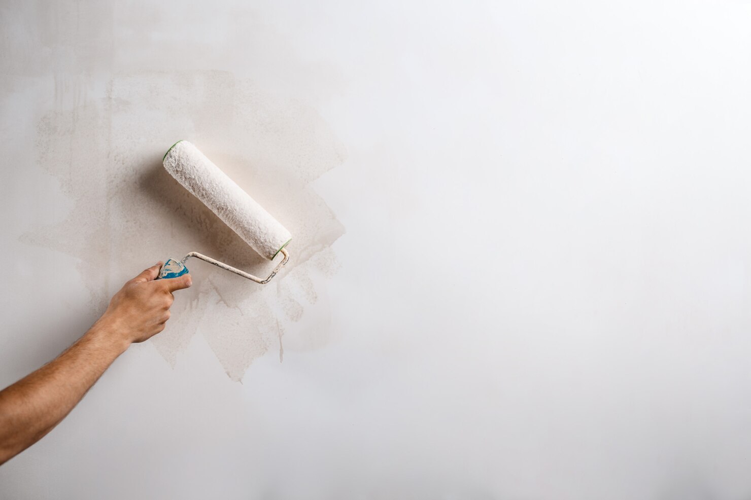 close up hand painting wall with roller 176420 4761