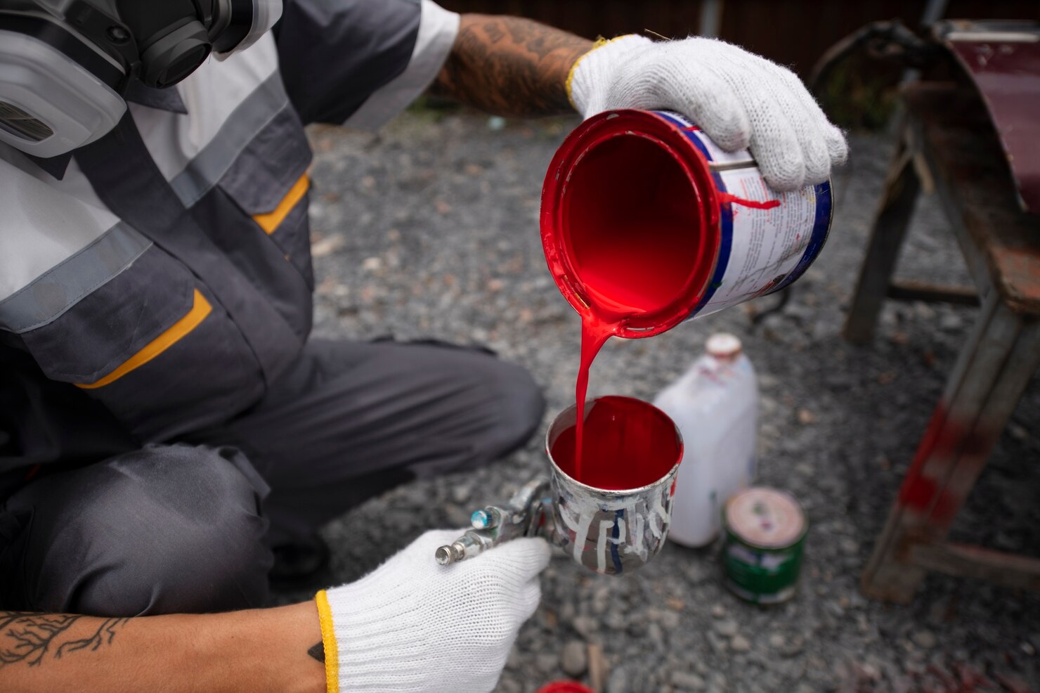 high angle man pouring paint 23 2149714287