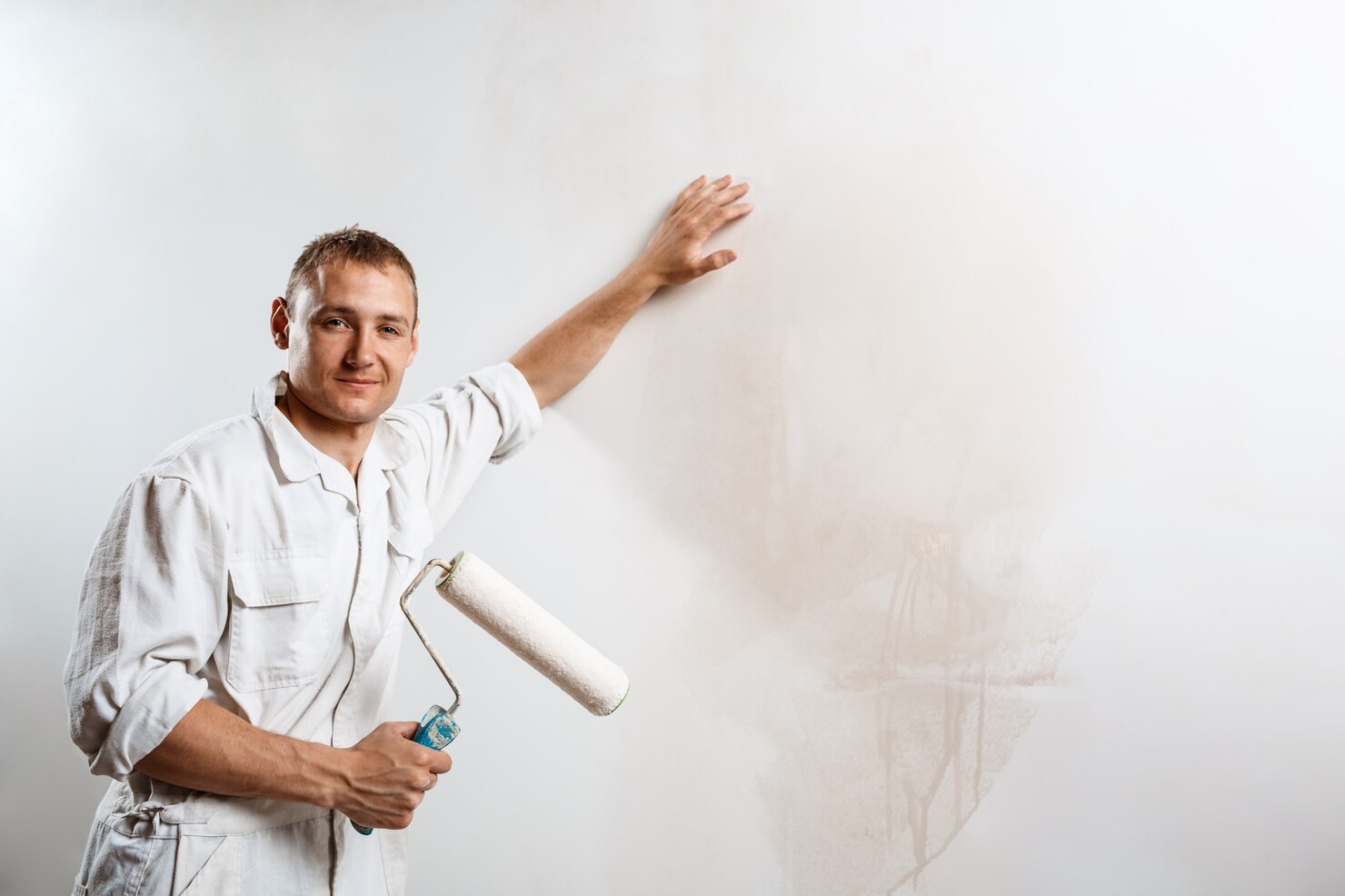 worker looking camera holding roller 176420 4764